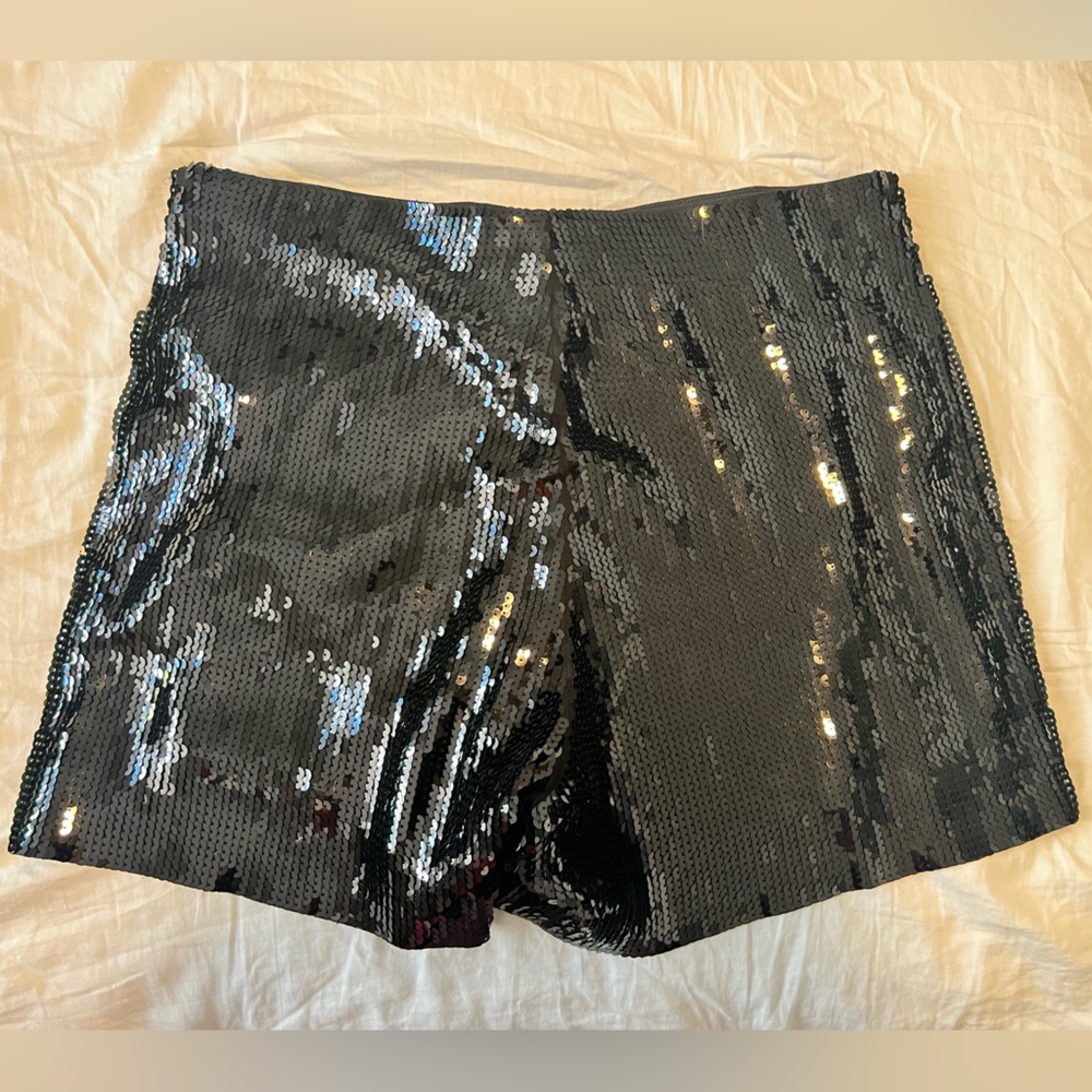 Black pull-on sequin shorts.